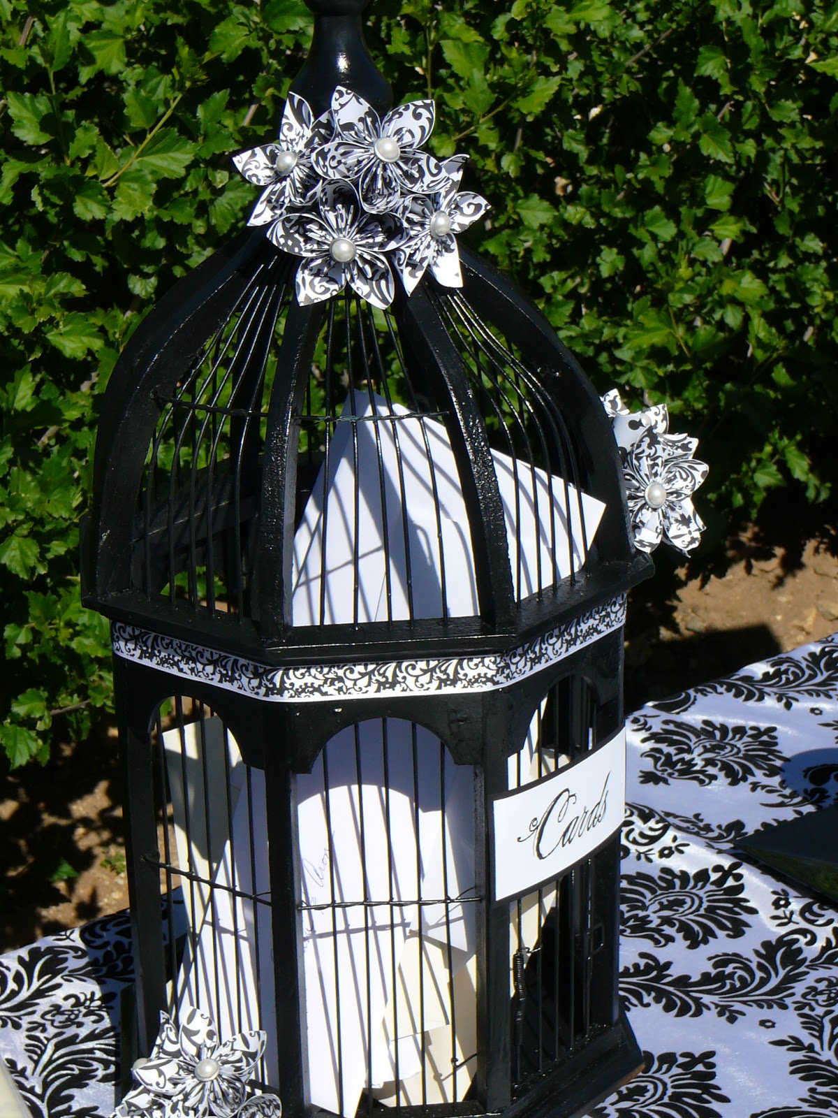 A Black and White Wedding Card Birdcage - perfect for holding your cards from wedding guests. 