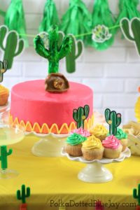 This fun and festive Cinco de Mayo Party tablescape is full of pink, yellow, and green decorations. Click through to see the whole party and a list of what you will need to throw your own Cinco de Mayo fiesta!