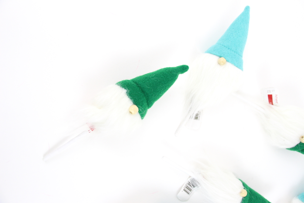 This year I am loving mint and green together with a tiny bit of pink and found these gnomes that were too cute to pass up. Keep reading to see how I made my Monogrammed Gnomes for Christmas Stockings.