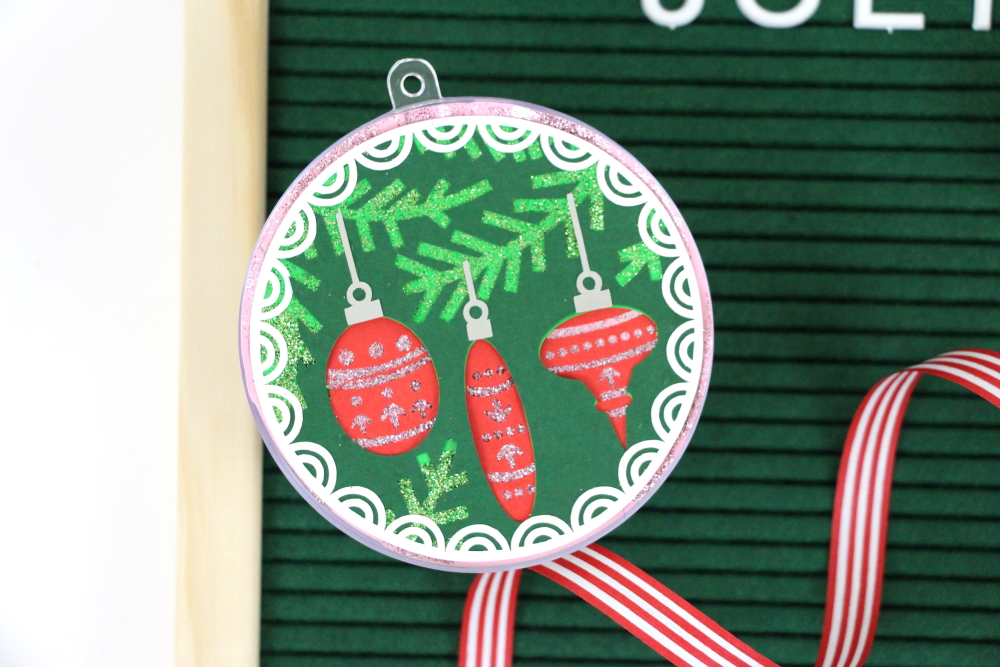 #ad It's Christmas in July! Grab a Holiday Ornament Kit from Silhouette America and make your own DIY Christmas Ornament. 10 FREE designs available when you purchase the kit. Click here to see a whole tutorial from Polka Dotted Blue Jay.