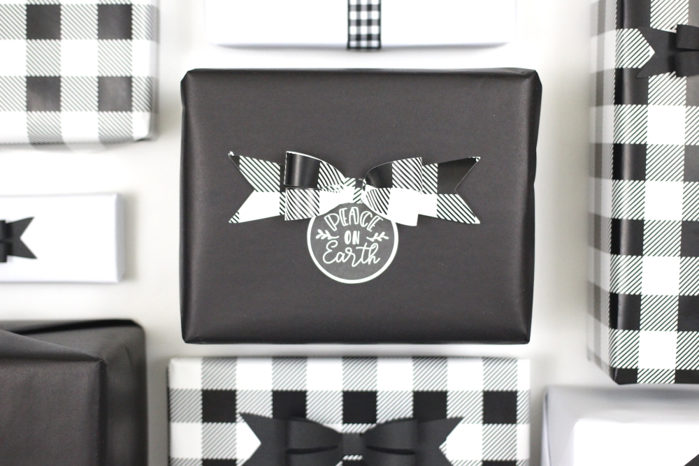How to make print and cut gift tags to match your black and white buffalo plaid gift wrap. Click here to see the tutorial and get the supply list.