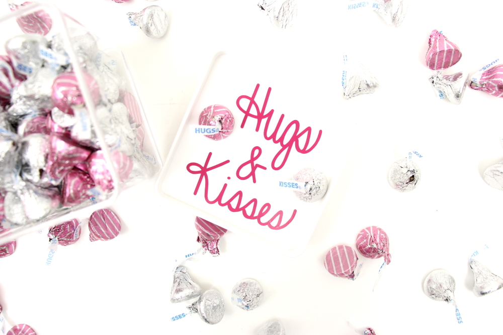 This Hugs and Kisses SVG is the new in the freebie library. Create this adorable candy jar with the Hugs and Kisses cut file for Valentine's Day.