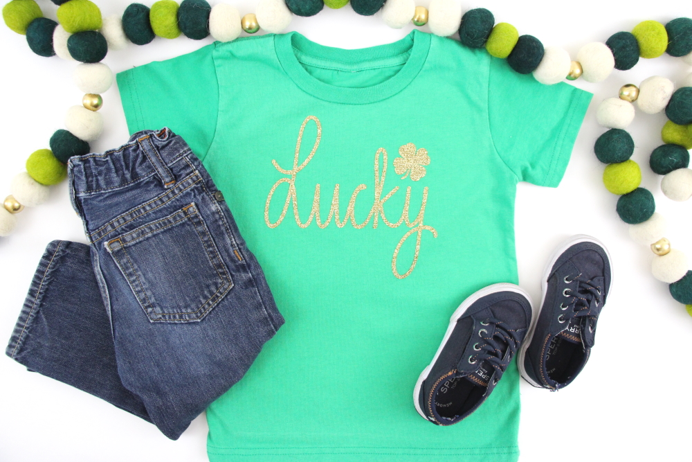 Follow this step-by-step tutorial to make a St. Patrick's Day t-shirt using a FREE handlettered Lucky SVG. Never get pinched again!