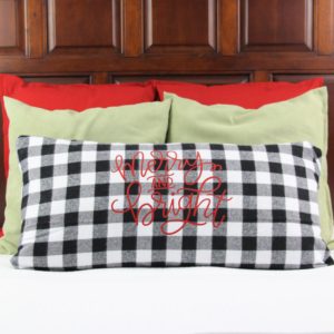 I have always loved the idea of creating themed bedding to coordinate with Christmas in our guest room and this year I finally made it happen with a Merry and Bright Pillow. I used my favorite black and white buffalo plaid for the pillow cover and a merry and bright SVG.