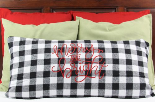 I have always loved the idea of creating themed bedding to coordinate with Christmas in our guest room and this year I finally made it happen with a Merry and Bright Pillow. I used my favorite black and white buffalo plaid for the pillow cover and a merry and bright SVG.