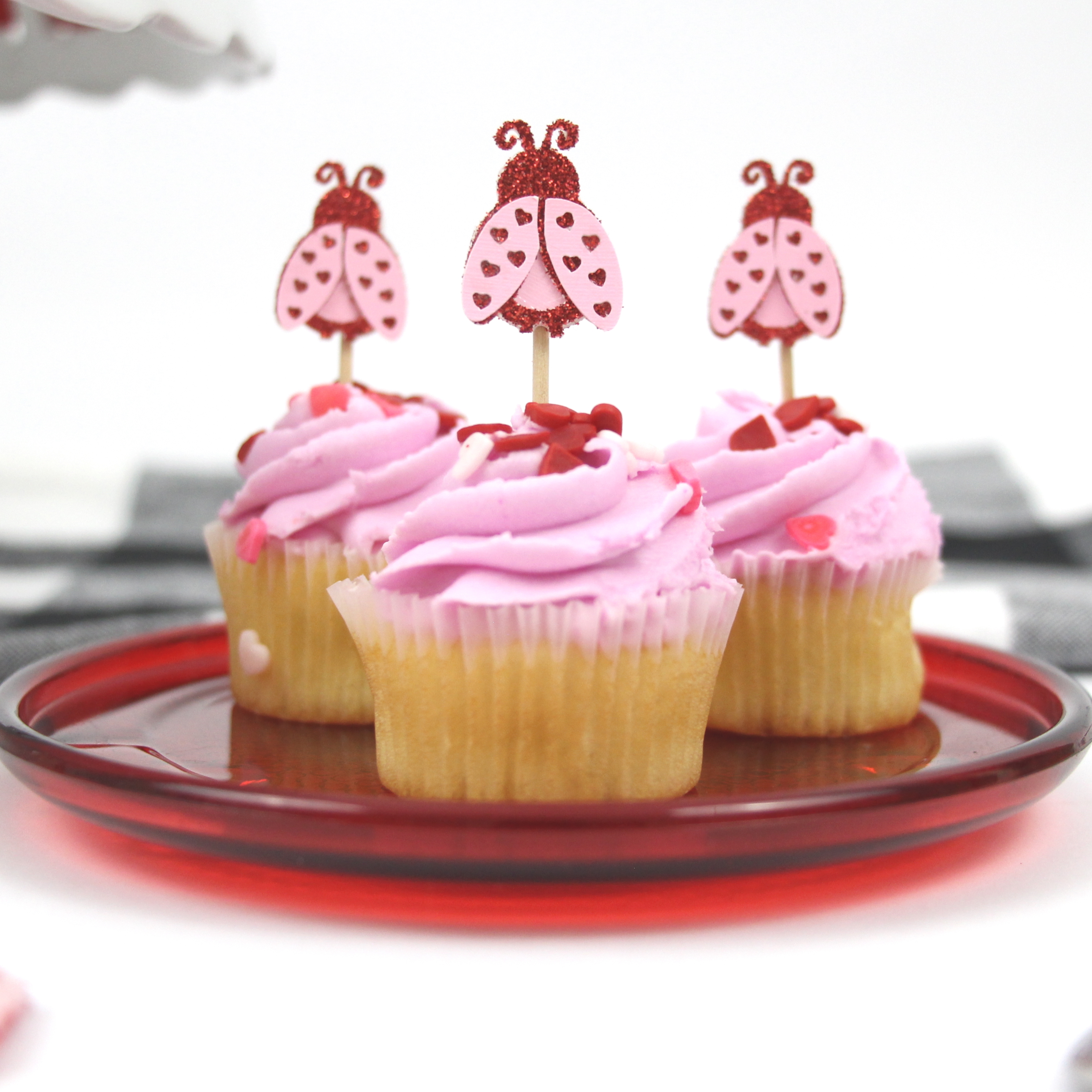 I love making holiday-themed cupcakes and I knew I had to make some love bug cupcake toppers with the design from Spot of Tea Designs for Valentine's Day. Click here for the whole tutorial.