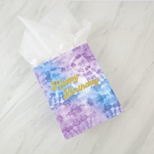 Make a tie dye gift bag with some adhesive vinyl and this FREE groovy Happy Birthday SVG