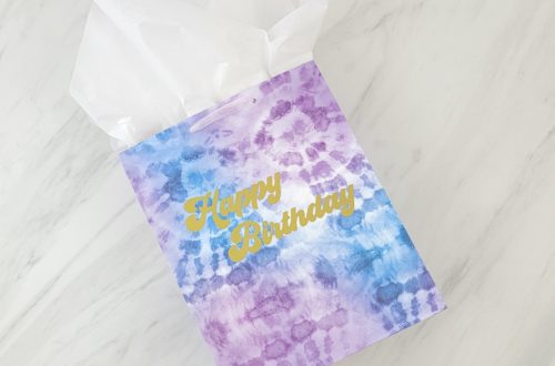 Make a tie dye gift bag with some adhesive vinyl and this FREE groovy Happy Birthday SVG